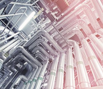 Equipment, cables and piping as found inside of a modern industrial power plant